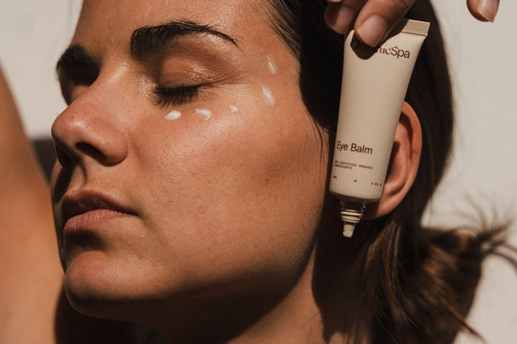 Organic Spa Eye Balm shown beside under-eye application dots.