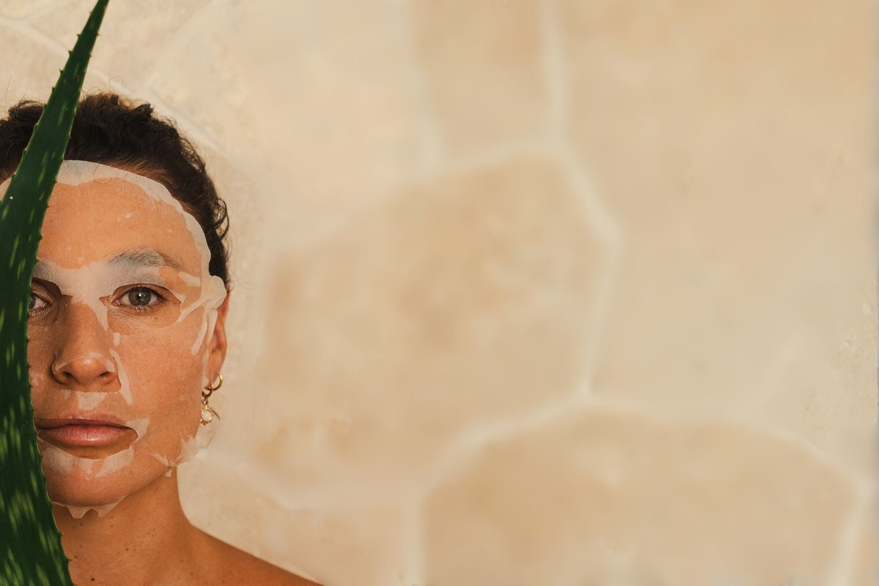 Organic Spa Hyaluronic Hydra+ Sheet Mask held in hands, close-up pack shot