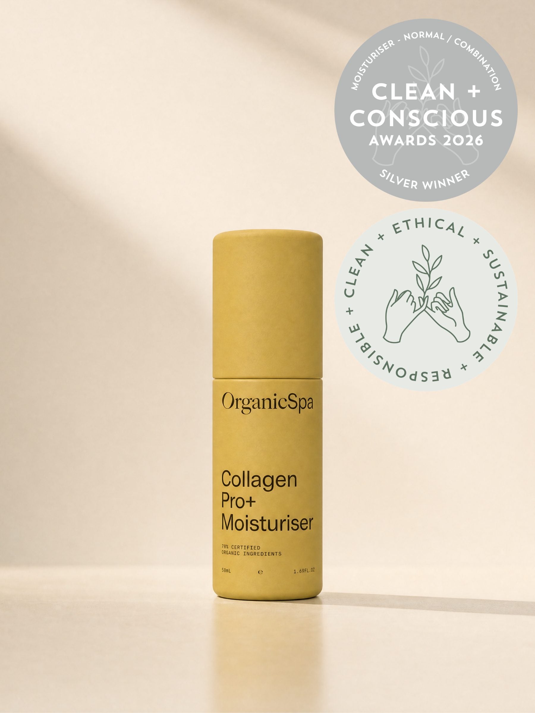 OrganicSpa CollagenPro+ Moisturiser, a chartreuse 50ml bottle marked 78% certified organic ingredients, standing in soft daylight. Award badges beside it: Silver winner in the Moisturiser, Normal/Combination category at the Clean + Conscious Awards 2026, and the awards' clean, ethical, sustainable and responsible seal.