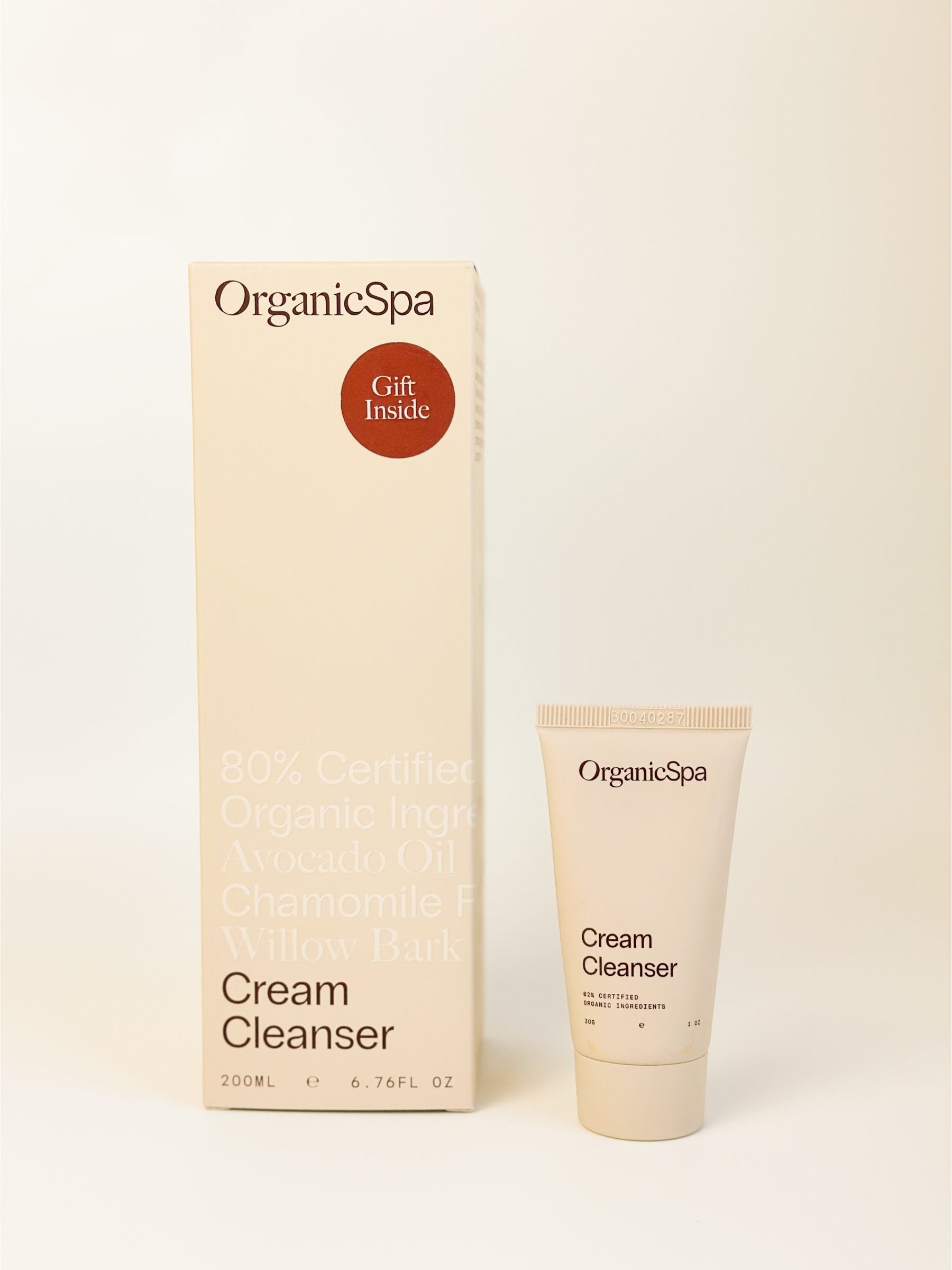 OrganicSpa Cream Cleanser carton with a Gift Inside sticker, beside the 30g Cream Cleanser Mini included with every full size.