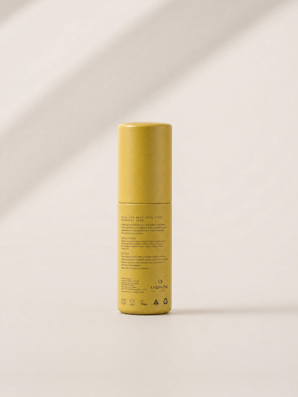 The back of the OrganicSpa Active Brightening Serum bottle. Ideal for most skin types, pigmented skin. A silky, lightweight serum to brighten and refine. Antioxidant-rich and gently active, it helps reduce pigmentation and promotes a more luminous, even-toned complexion. Apply half a pump morning and night before moisturiser, pressing gently into the face, neck and décolletage, avoiding the eye area. Certified COSMOS Organic by ACO, with vegan, cruelty free, Australian made and recyclable symbols.