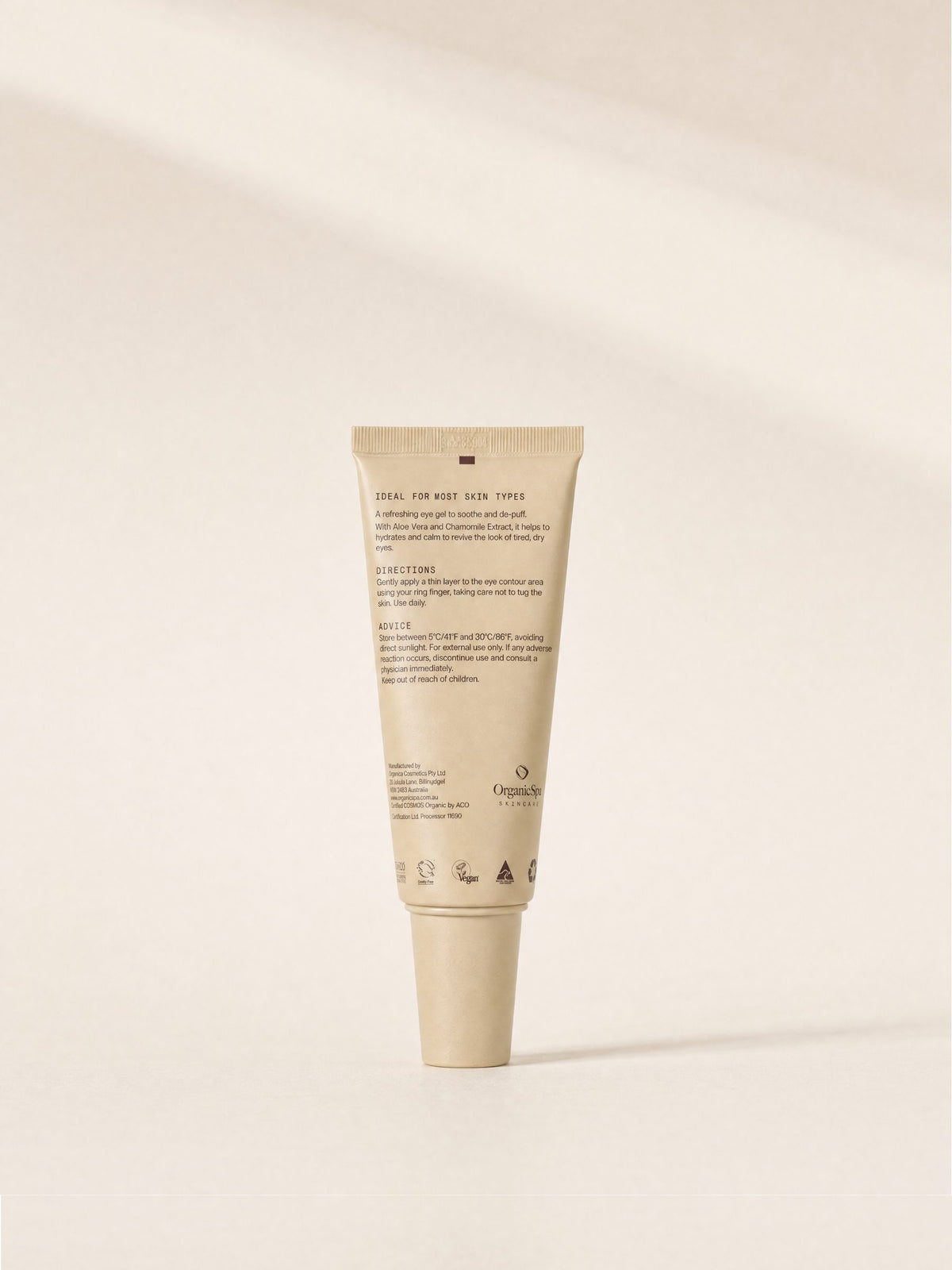 The back of the OrganicSpa Eye Balm tube. Ideal for most skin types. A refreshing eye gel to soothe and de-puff, with Aloe Vera and Chamomile Extract to help hydrate and calm and revive the look of tired, dry eyes. Apply a thin layer to the eye contour with your ring finger, taking care not to tug the skin, daily. Certified COSMOS Organic by ACO, with vegan, cruelty free, Australian made and recyclable symbols.