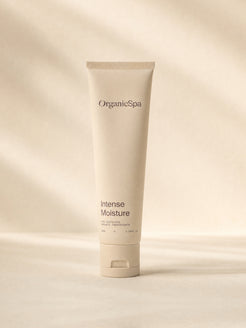 OrganicSpa Intense Moisture, a sand-coloured 50ml tube marked 87% Certified Organic Ingredients, on a plain background.