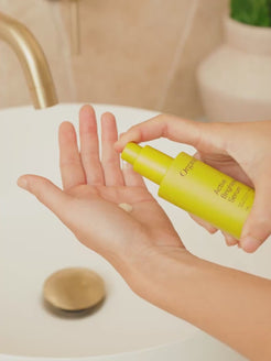 lose-up video of OrganicSpa Active Brightening Serum being pumped onto fingertips then gently pressed into the skin. Certified Organic Skincare.